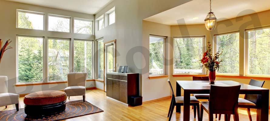 Claresholm dining room & living room large windows that can be tinted to provide UV protection.